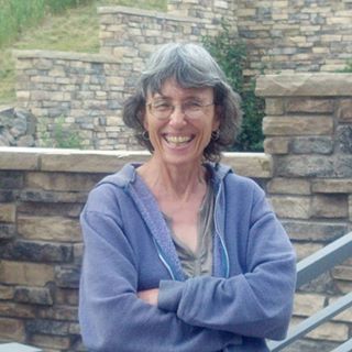 Mary Van Pelt smiling for the camera outside